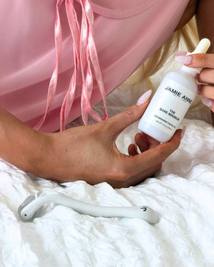 Woman holding a set of The Bare Minimum and The Roller