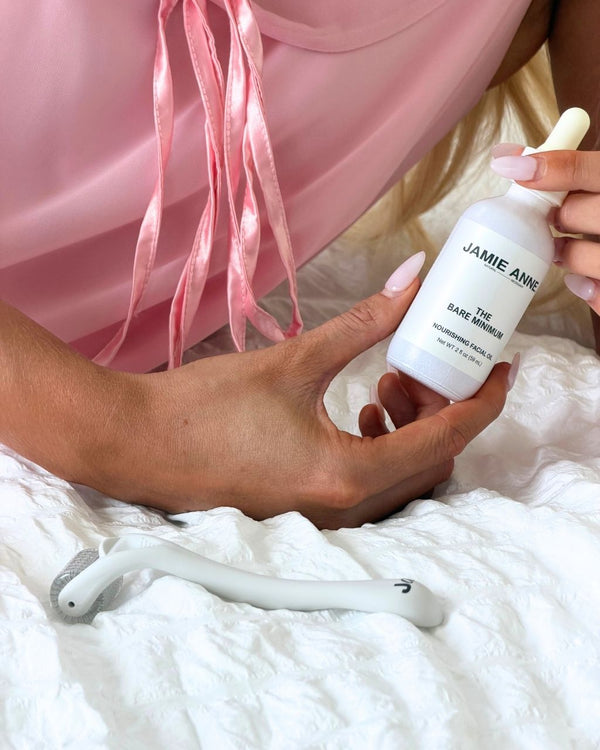 Woman holding a set of The Bare Minimum and The Roller