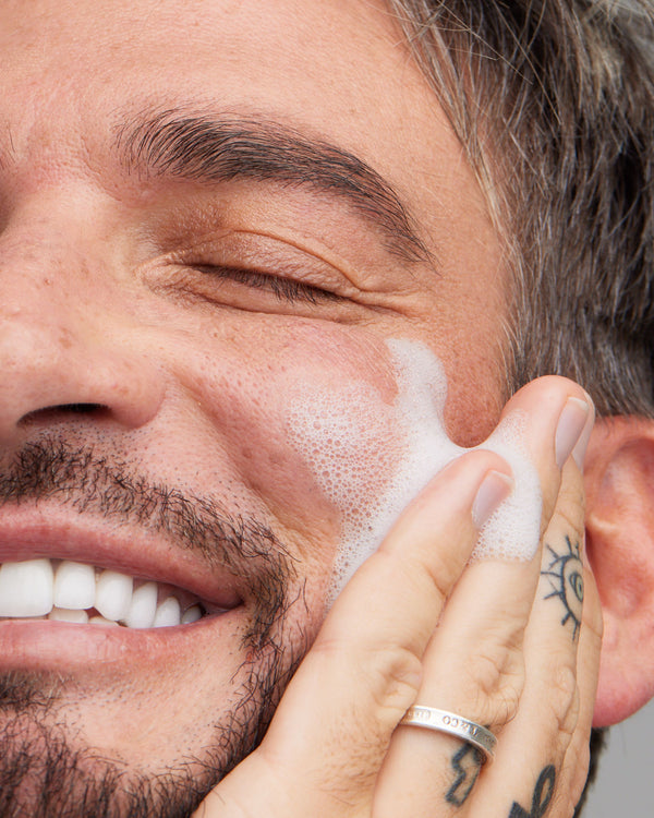Close-up of smiling man washing his face with Young Goose Adaptogenic Cleanser #30ML #120ML #180ML