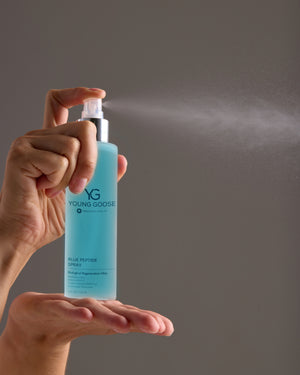 Person holding a Young Goose Blue Peptide Spray #30ML #120ML